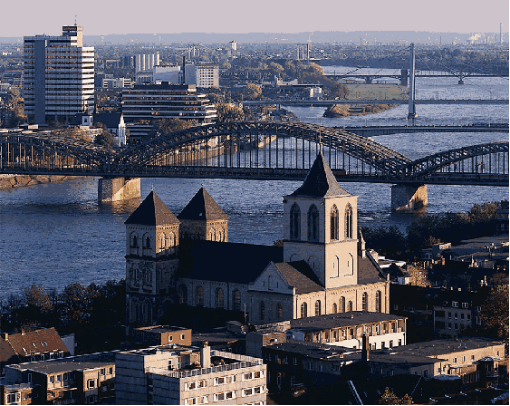 St. Kunibert (Bild: Außenansicht mit Rheinbrücken) - (Sept. 2006)